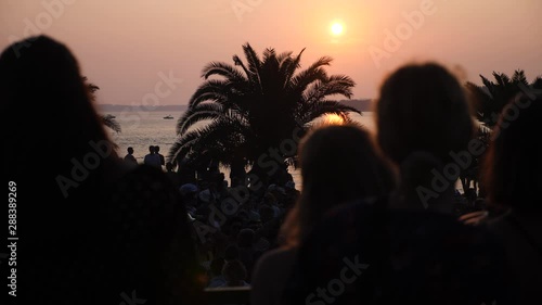Girls dancing in the festival at sunset