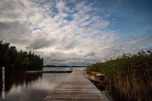 Fototapeta Naklejka Na Ścianę i Meble -  lake in Sweden with a landing stage in the foreground