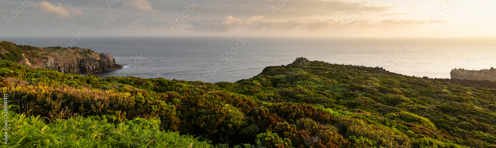 Amazing green landscape at sunrise at the mirador de Alagoa of the Agualva coastline on Terceira, Azores