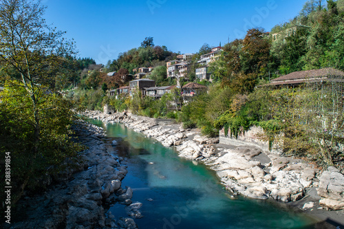 Homes along the rocky banks of the Rioni River in Kutaisi  Georgia