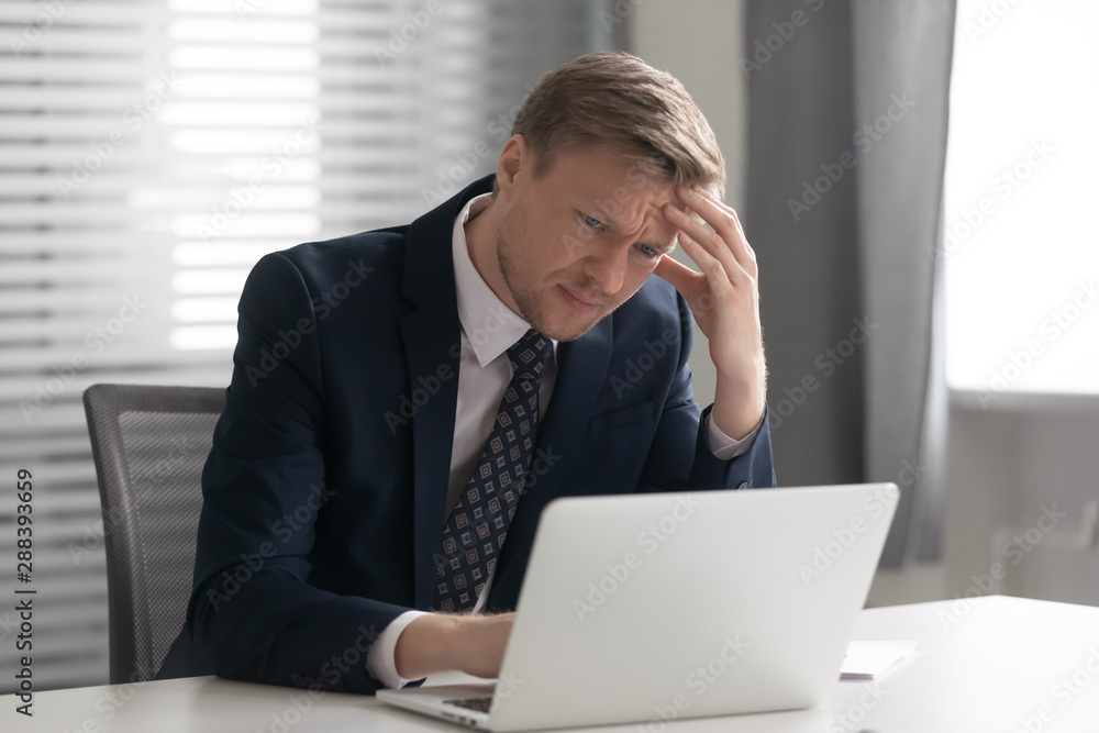 Stressed middle aged businessman worried about work mistake. Stressed middle aged businessman worried about work mistake.