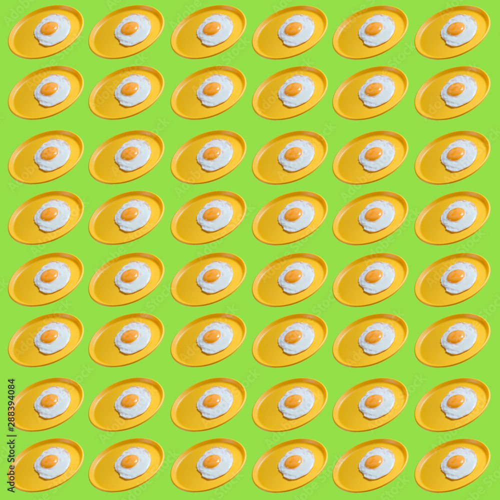 pattern fried eggs on a light green background. pattern fried eggs on a light green background.