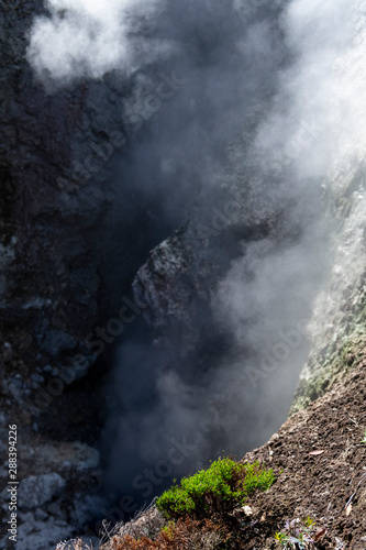 Detail of fumarole emitting gases and steam at the Jardim da Courela garden in the centre of the village of Furnas on São Miguel island in the Azores.