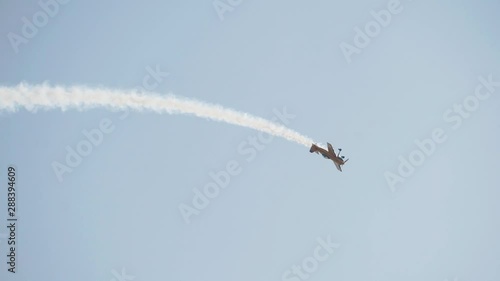 Yellow plane performs a loop. Cool Airshow. Amazing event.