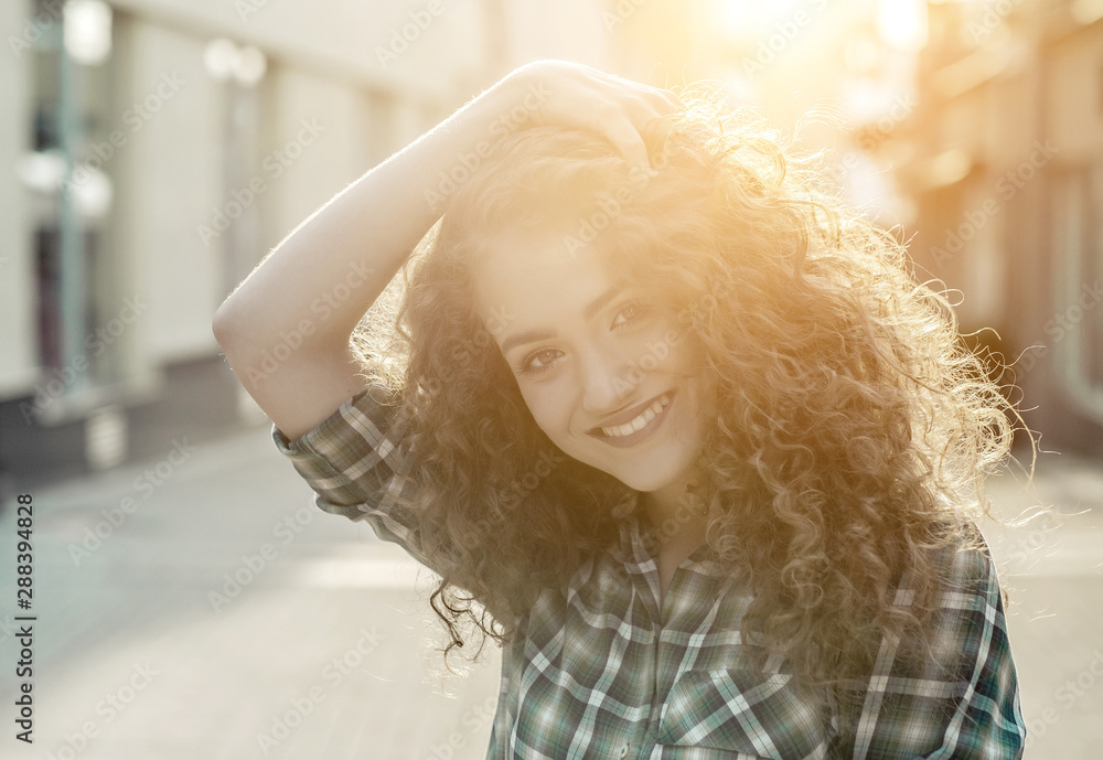 Atmospheric portrait of smiling young natural beautiful lady on Atmospheric portrait of smiling young natural beautiful lady on
