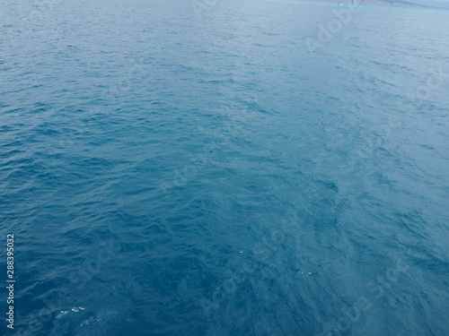 Dark blue water surface. Sea or ocean water background.