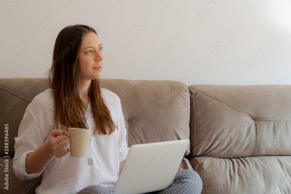 Business lady drinking tea and working at her home. Home office, Morning light. Business lady drinking tea and working at her home. Home office, Morning light.