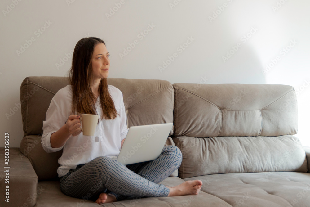 Business lady drinking tea and working at her home. Home office, Morning light. Business lady drinking tea and working at her home. Home office, Morning light.
