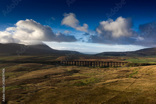 Wallpaper Mural Ariel picture of Yorkshire landmark Ribblehead Viaduct, North Yorkshire, Yorkshire Dales, Sunrise, Clouds, Railway, Landscape, Grassland, Ingleborough © Julian Hodgson 2019 Torontodigital.ca