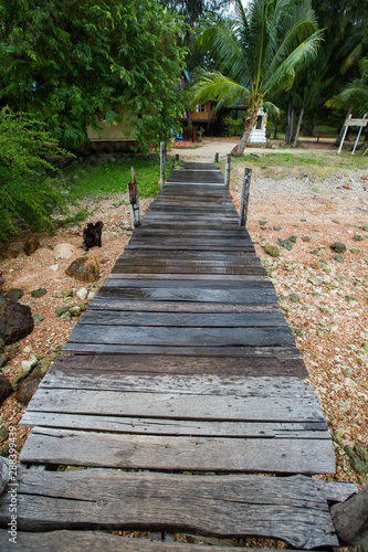 a rusty wooden sidewalk in a resort area, Koh Talu, Thailand
