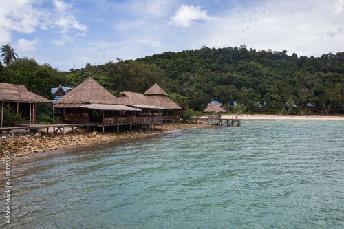 The shoreline of Koh Talu Island Thailand, with wooden balcony on the beach © Roni