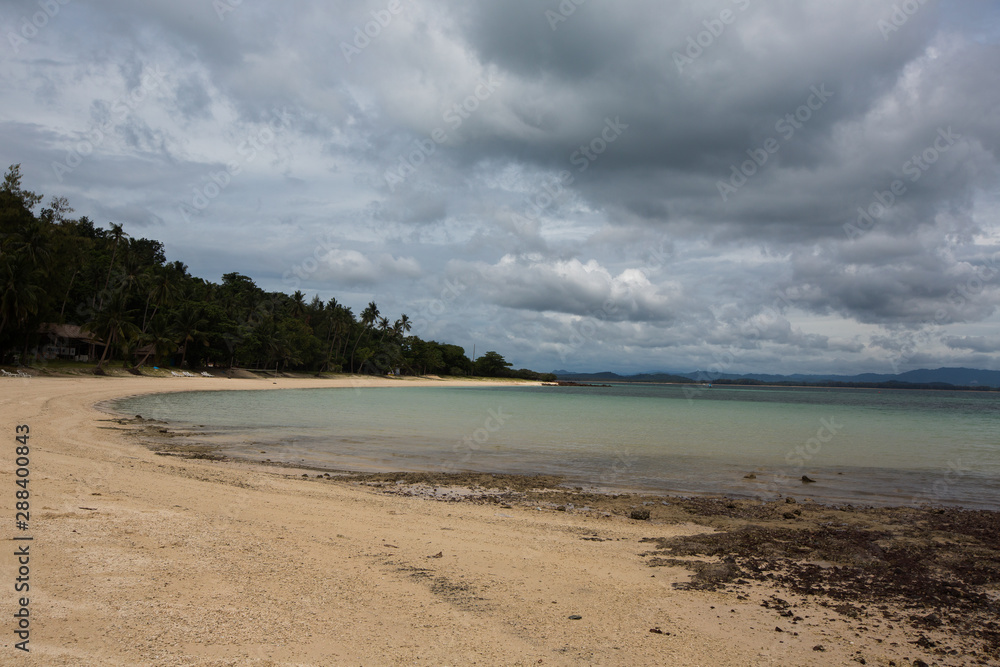 The shore of  Koh Talu Island Thailand on a cloudy day