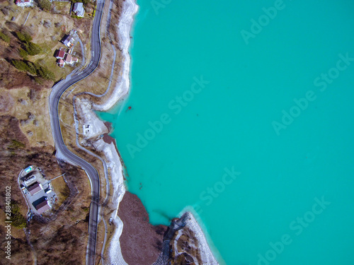 Aerial zenital view of amazing colorful Barcis green lake in Friuli Venezia Giulia. Nature trekking destinations and Mountain tourism icon  photo