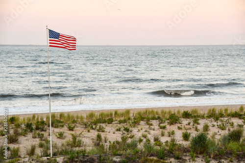 US flag flying over Dewey Beach at sunset