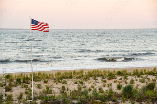 Photos US flag flying over Dewey Beach at sunset