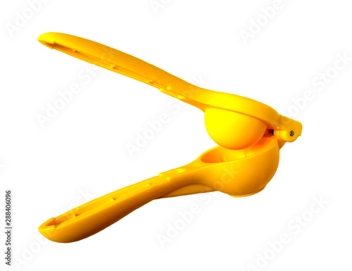 Schilderij op canvas Manual yellow lemon squeezer isolated on white background