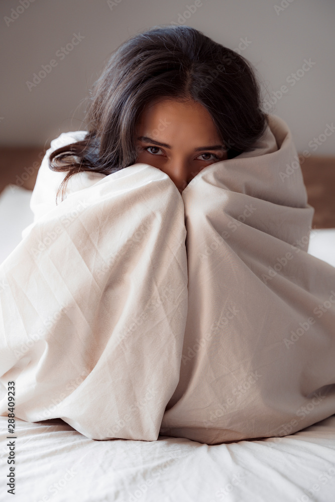 Young woman spending time in her bed Young woman spending time in her bed
