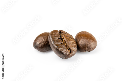 Wallpaper Mural Three shiny fresh roasted coffee beans isolated on white background. Coffee background or texture concept. Torontodigital.ca