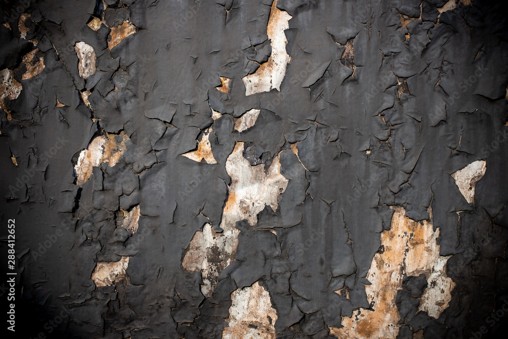 Abstract background of a peeling black paint