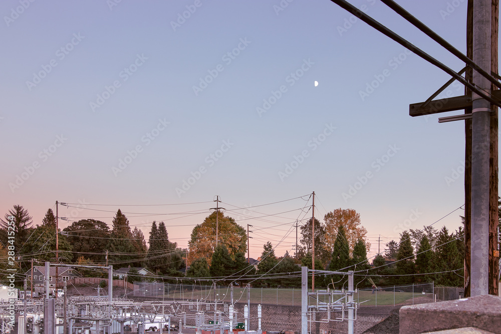 Electrical Infrastructure Next To A Residential Neighborhood And a Field of Grass In NE Portland, Oregon. Space for copy