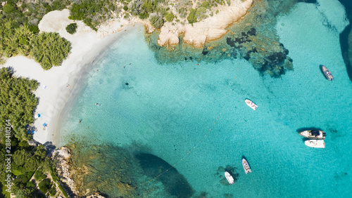 Obraz na płótnie View from above, stunning aerial view of some boats and luxury yachts floating on a turquoise water. Maddalena Archipelago National Park, Sardinia, Italy. w salonie