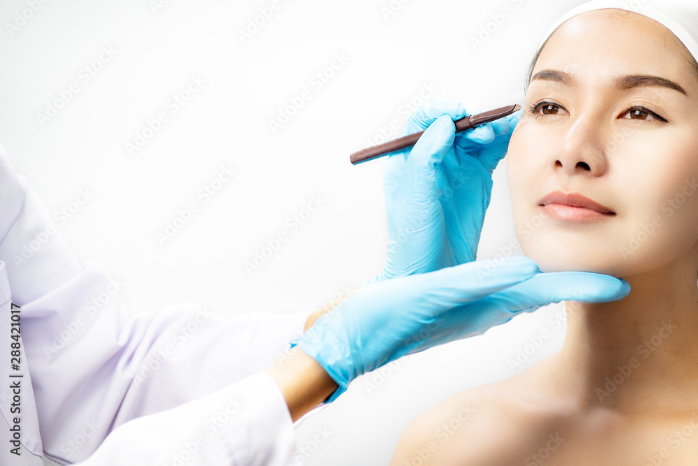 Anti-aging concept Plastic surgery concept Doctor's hands in gloves touching face of beautiful woman. Anti-aging concept Plastic surgery concept Doctor's hands in gloves touching face of beautiful woman.