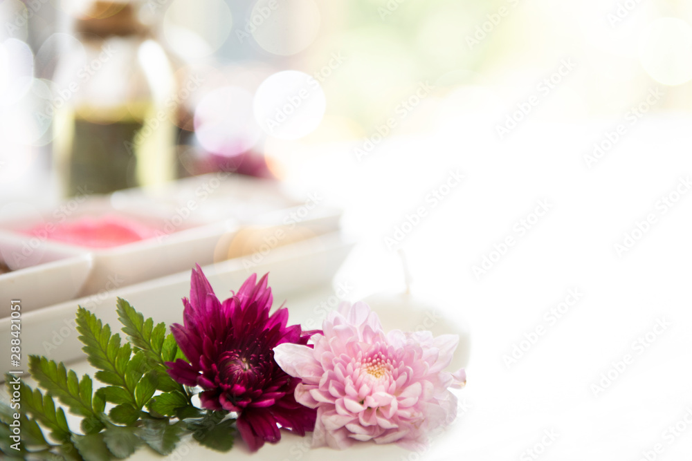 Spa and wellness setting with flowers and towels. Day Spa nature products