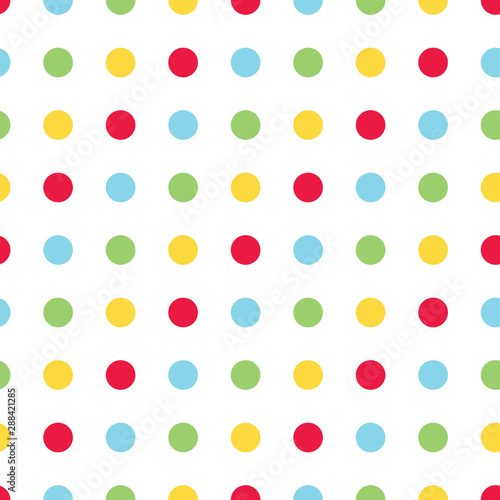Bright polka dot vector seamless pattern. Primary colors of red, green, blue and yellow. Great for kids and babies.