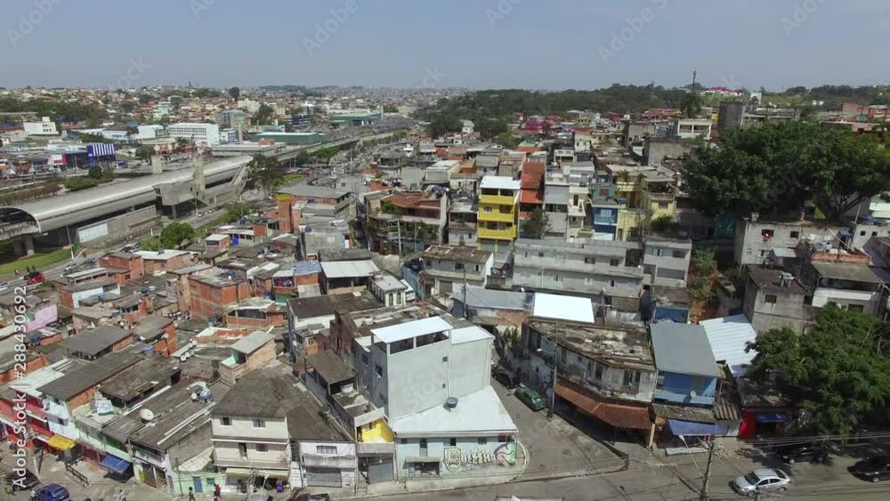 Crossing, streets, houses. Poor neighborhood. City of Sao Paulo, Jardim Avenue neighborhood. Capao Redondo Subway. Brazil. 