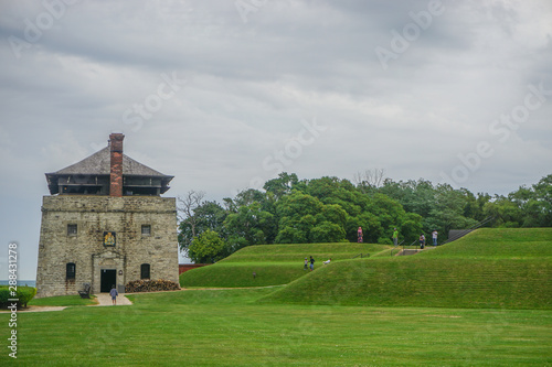 Porter, New York, USA: Visitors at the North Redoubt on the 23-acre grounds of Old Fort Niagara, on a cloudy day on Lake Ontario.