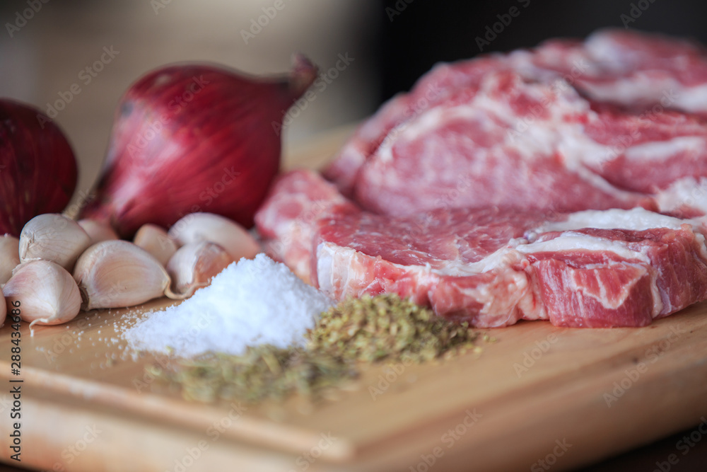 Close up raw pork on cutting board