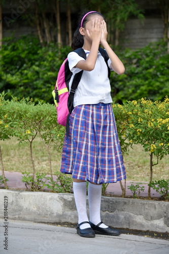 Failed Prep Girl Student Wearing Uniform With Books © dtiberio