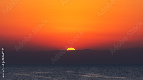 Amazingly vibrant colorful sunset scenery © Vastram