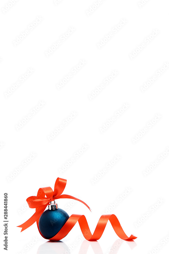 Blue christmas ball with red ribbon on a white Blue christmas ball with red ribbon on a white
