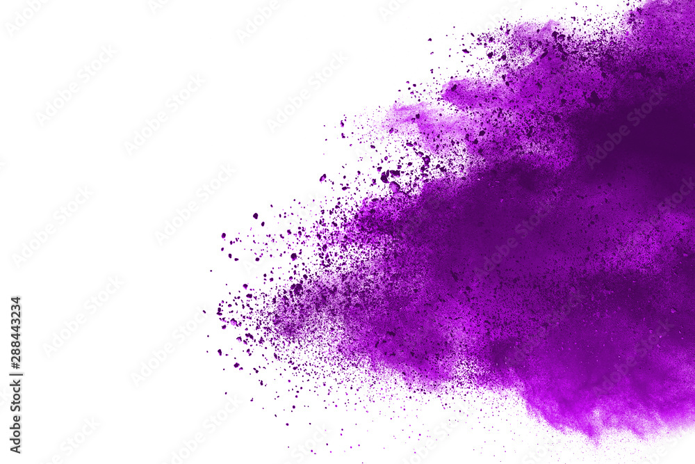 Freeze motion of purple color powder exploding on white background. Freeze motion of purple color powder exploding on white background.