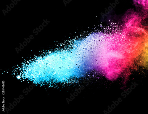 Explosion of colored powder isolated on black background. Abstract colored background. holi festival.