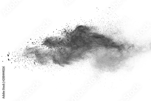 abstract powder splatted background. Black powder explosion on white background. Colored cloud. Colorful dust explode. Paint Holi.