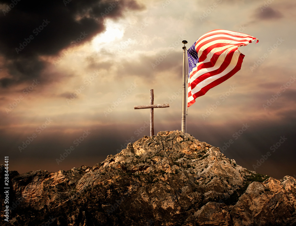 Φωτογραφία Conceptual image of waving American flag at tall pole and wooden cross over suns