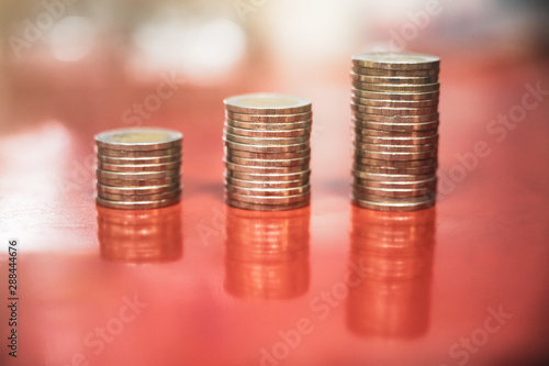 step of coins stacks, money, saving and investment or business planning concept.