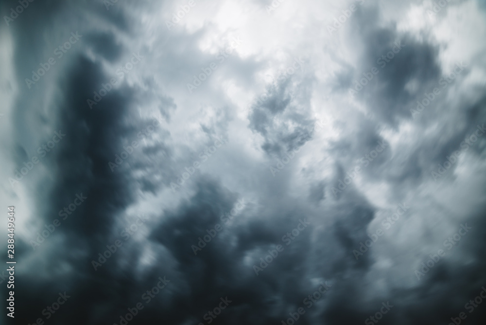 Dramatic cloudscape texture. Dark heavy thunderstorm clouds before rain. Overcast rainy bad weather. Storm warning. Natural gray background of cumulonimbus. Nature backdrop of stormy cloudy sky.