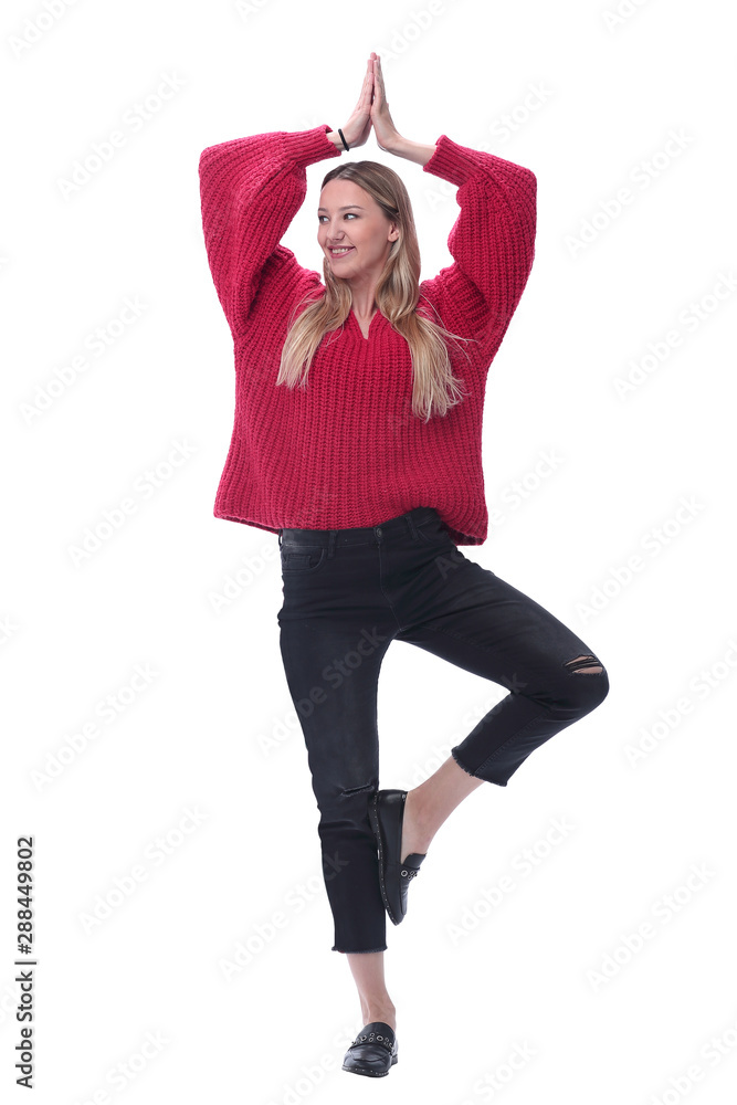cheerful young woman standing in ballet pose. isolated on white cheerful young woman standing in ballet pose. isolated on white