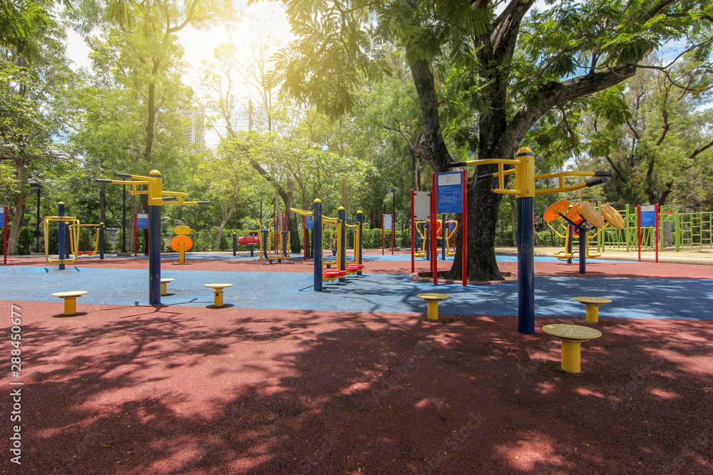 Fitness area in the garden surrounded by green trees Fitness area in the garden surrounded by green trees