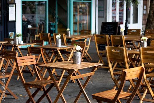 Empty wooden tables and chairs outside city centre restaurant with shallow depth of field © Barry Barnes