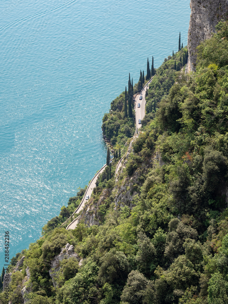 Lake Garda, Italy. Aerial view of the amazing and panoramic road built on the shores of the lake. The road is called Gardesana