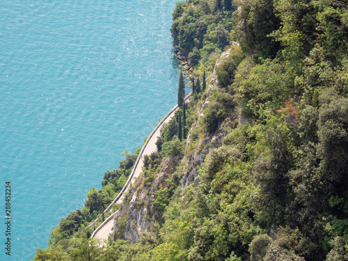 Lake Garda, Italy. Aerial view of the amazing and panoramic road built on the shores of the lake. The road is called Gardesana photo