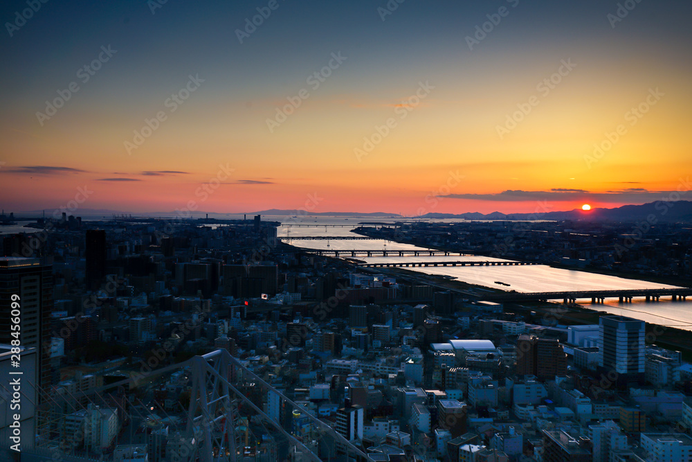 High angle view of Osaka city with Yodo river at sunset time in the Kansai Region from Umeda Sky building