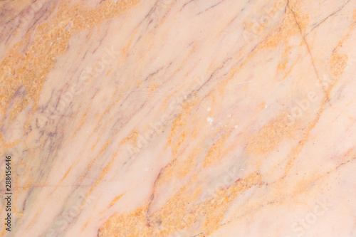 patterned detailed of orange cream marble texture, background and interior design.