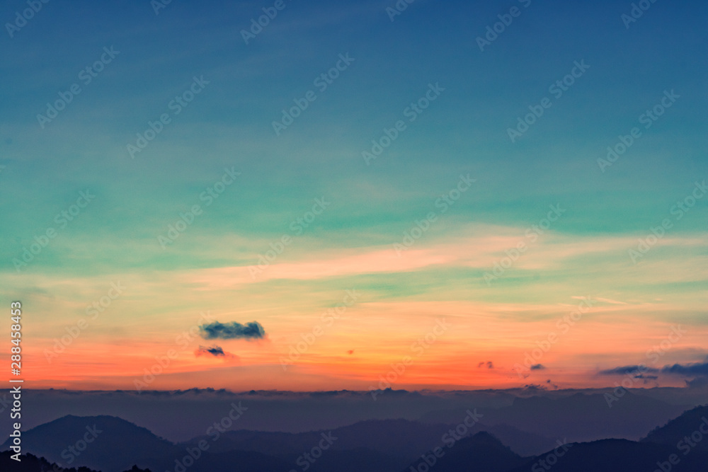silhouette shot image of mountain and sunset sky in background. silhouette shot image of mountain and sunset sky in background.