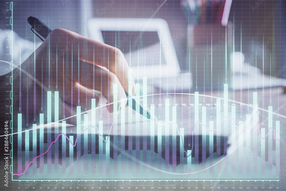 Financial charts displayed on woman's hand taking notes background. Concept of research. Double exposure Financial charts displayed on woman's hand taking notes background. Concept of research. Double exposure