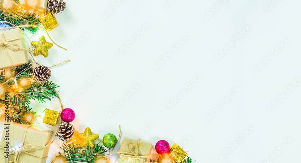Christmas or New Year background. fir tree branches, gift box, decoration on a white background with copy space for your text. Top view.